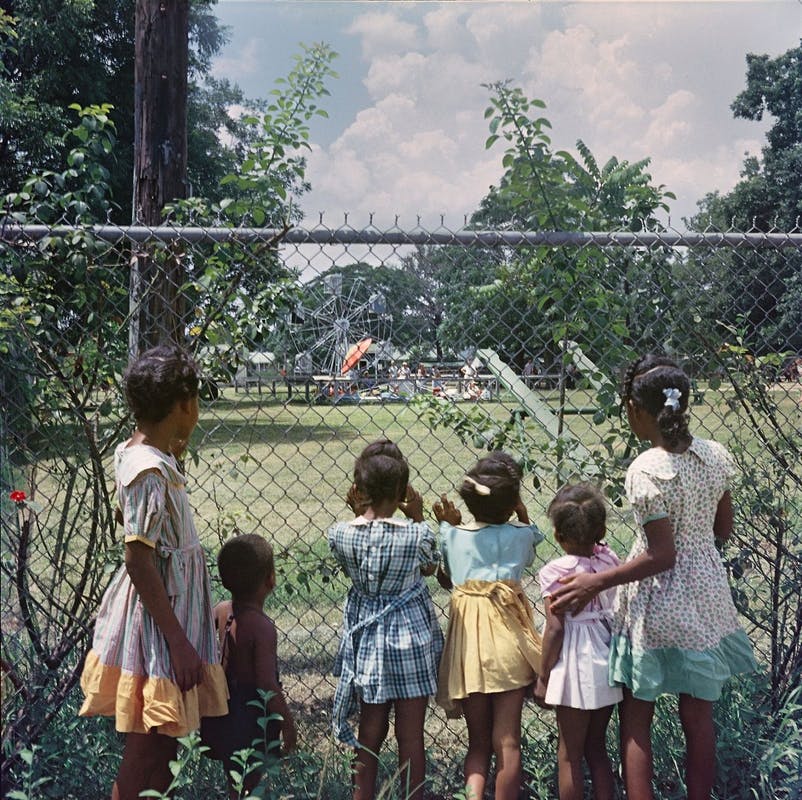 African American Children Peering into a Whites Only Playground in Mobile, Alabama, 1956 by Gordon Parks